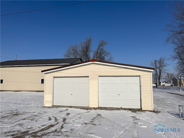 view of snow covered garage