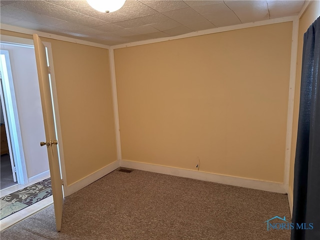 unfurnished room featuring carpet flooring