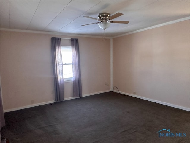 carpeted spare room featuring ceiling fan and ornamental molding