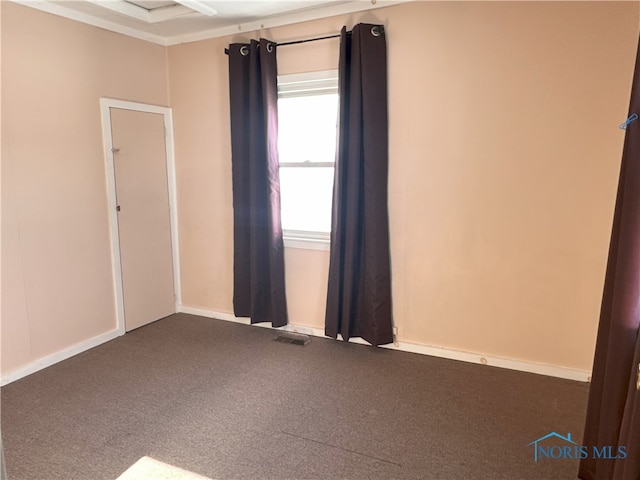 unfurnished room with carpet flooring