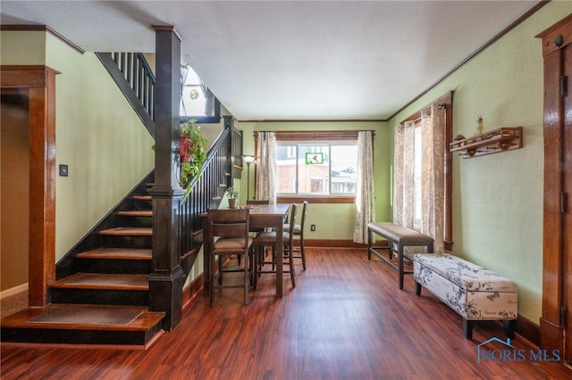 dining room featuring dark hardwood / wood-style flooring and ornamental molding