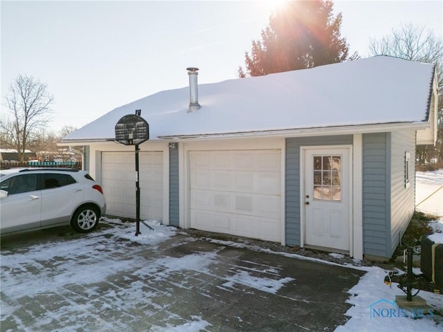 view of snow covered garage