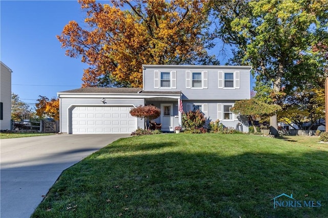 front of property with a garage and a front lawn