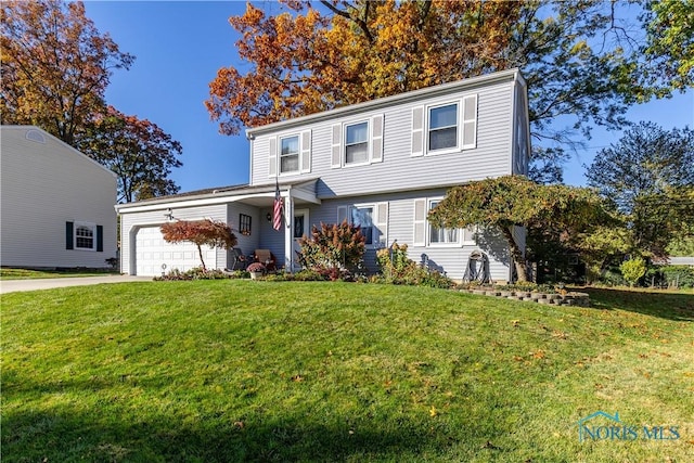 front facade with a garage and a front lawn