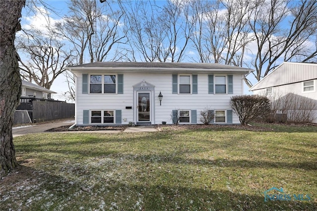 bi-level home with a front lawn