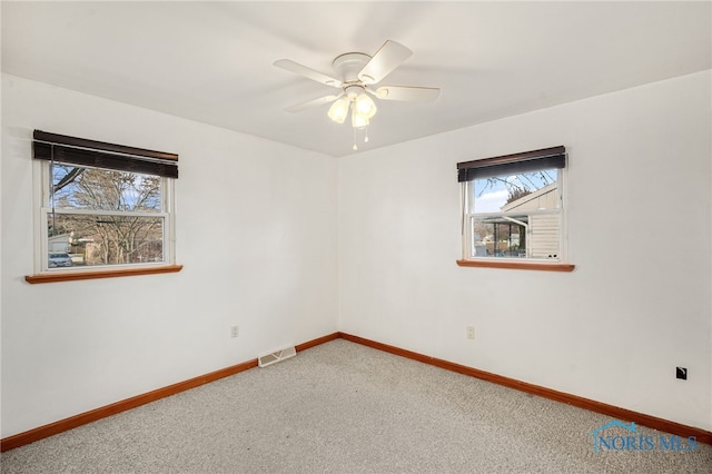 carpeted empty room with ceiling fan