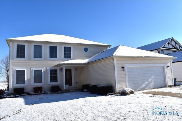 view of front of property with a garage