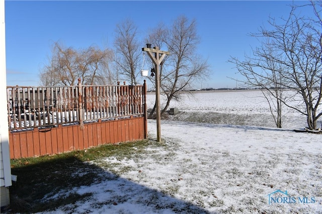 view of yard layered in snow