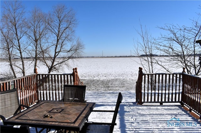 wooden deck featuring a water view