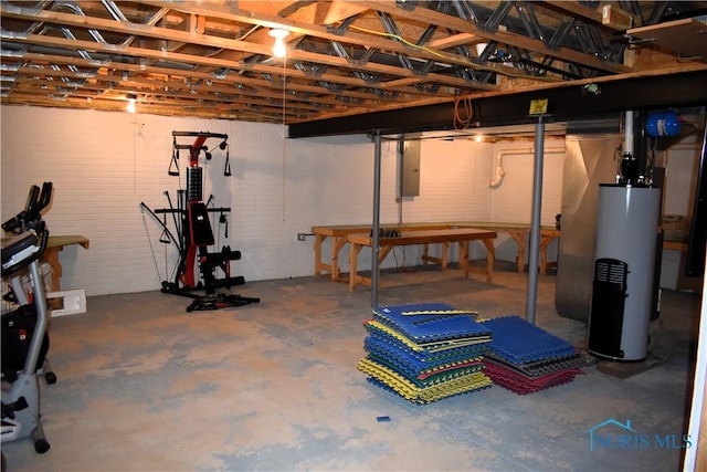 basement with electric panel and water heater