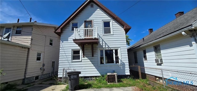 back of property featuring central AC unit