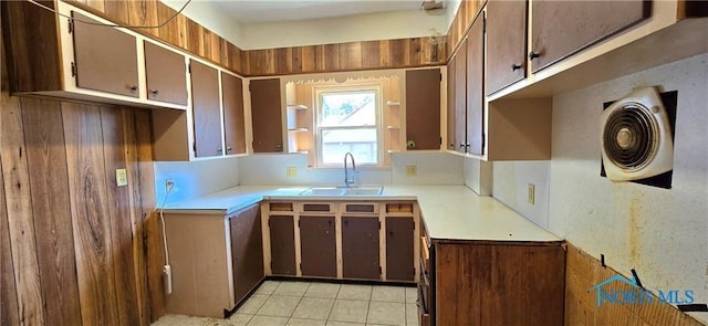 kitchen featuring light tile patterned flooring and sink