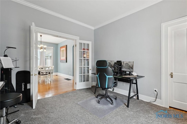 office featuring carpet flooring, crown molding, and a notable chandelier