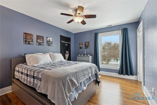 bedroom featuring ceiling fan and hardwood / wood-style flooring