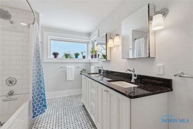 bathroom with shower / tub combo with curtain and vanity