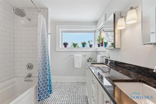 bathroom featuring vanity and shower / bath combination with curtain