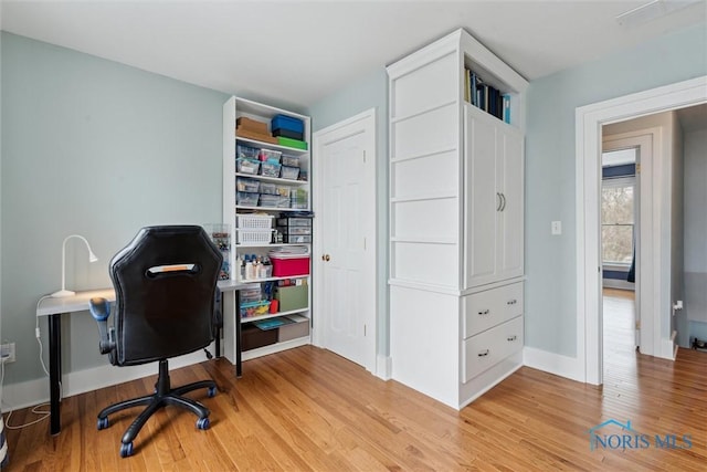 home office featuring light hardwood / wood-style flooring