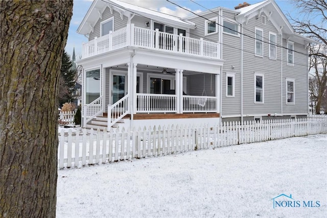 view of front of home with a balcony and covered porch