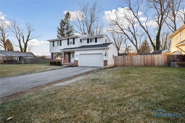 front facade with a front lawn and a garage