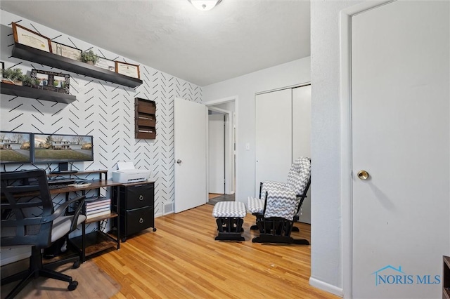 office area with light hardwood / wood-style flooring