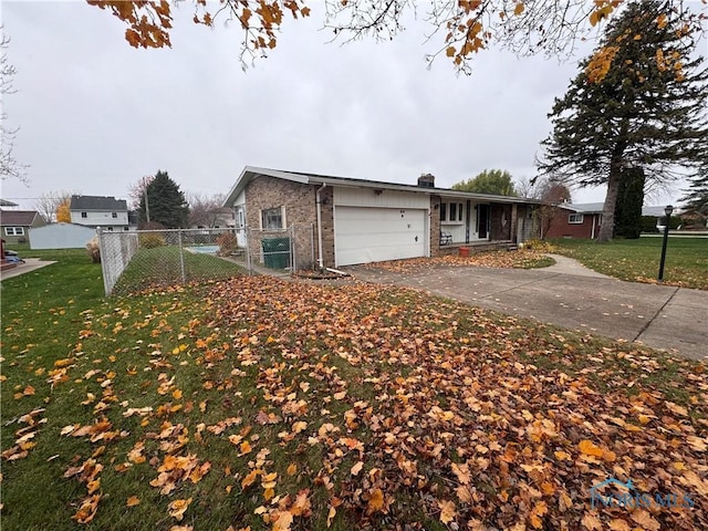 view of property exterior featuring a lawn and a garage