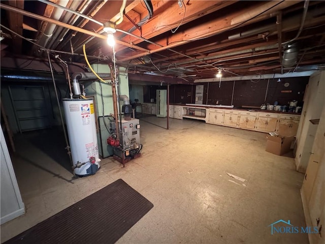 basement featuring gas water heater and water heater