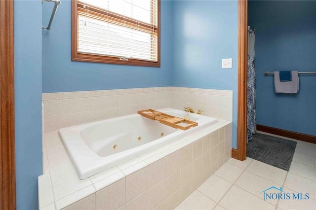 bathroom featuring tile patterned floors and tiled tub