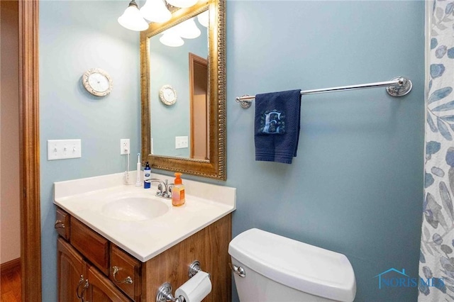 bathroom with vanity and toilet