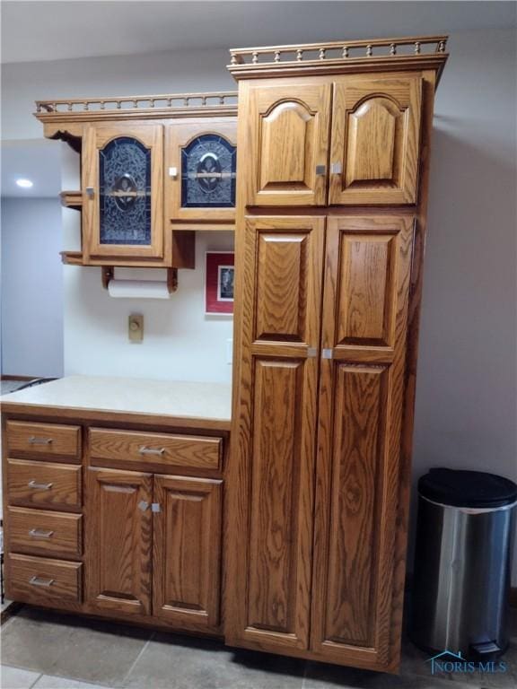 kitchen with light tile patterned flooring