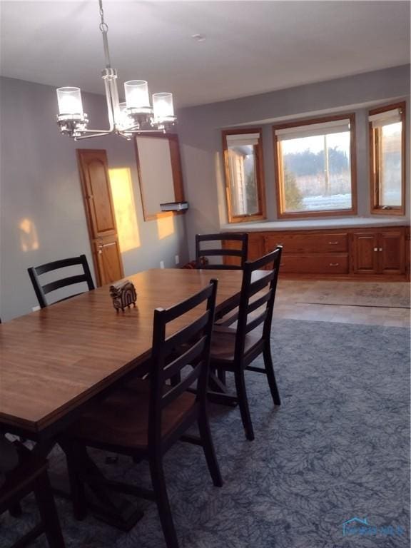 dining room featuring a chandelier