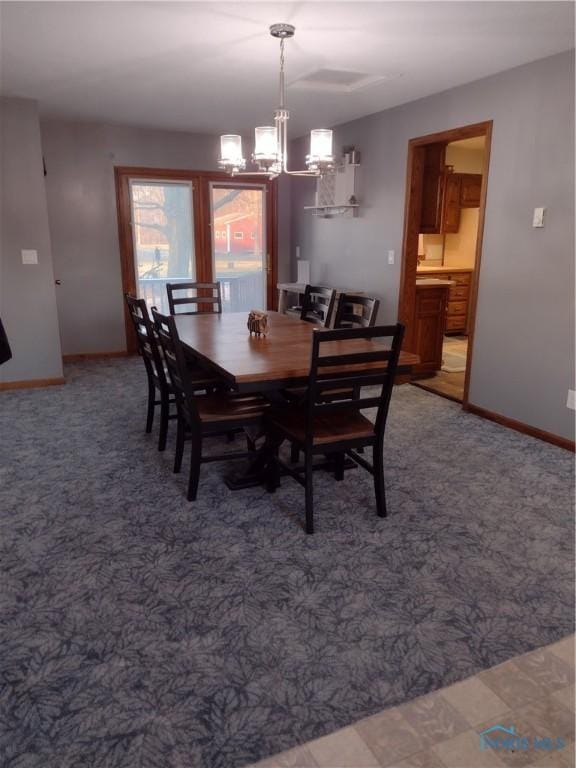 dining area featuring a chandelier