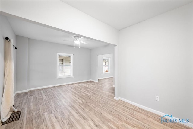 spare room with ceiling fan and light hardwood / wood-style floors