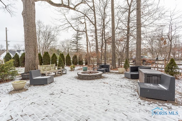 view of property's community with an outdoor fire pit