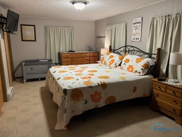 bedroom with a baseboard radiator