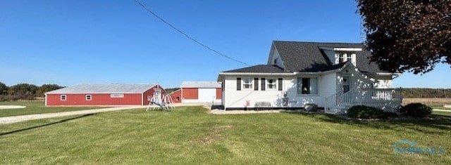 view of side of home featuring a lawn