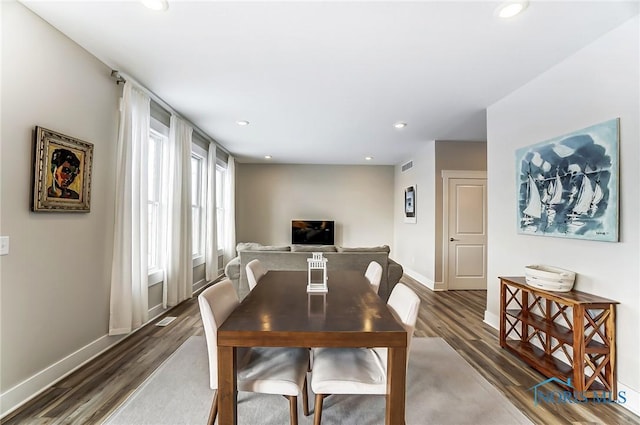 dining area featuring dark hardwood / wood-style floors