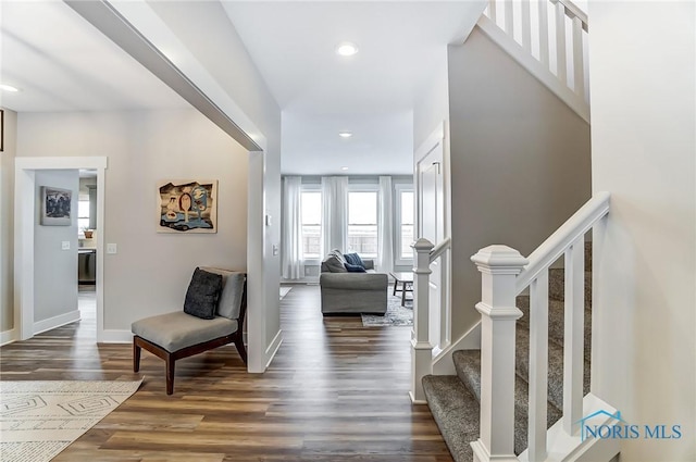 corridor with dark hardwood / wood-style floors