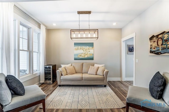 living room featuring wine cooler and hardwood / wood-style flooring