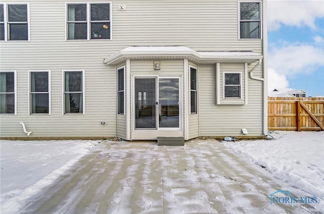 view of snow covered house