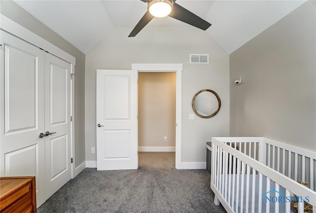 bedroom featuring light carpet, a closet, ceiling fan, and lofted ceiling