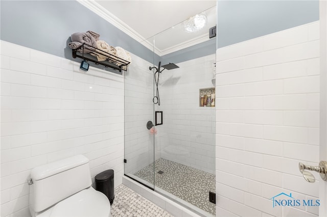 bathroom with crown molding, a shower with door, tile patterned flooring, and toilet