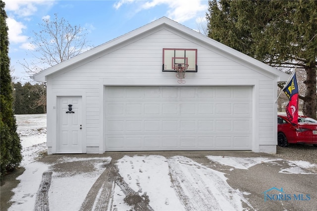 view of snow covered garage