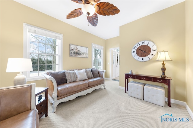 carpeted living room featuring ceiling fan