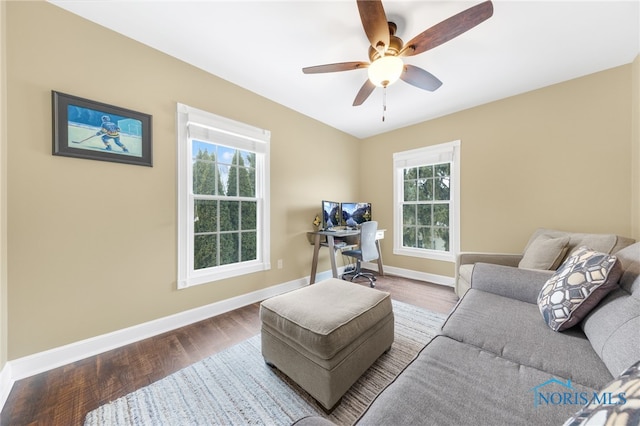 living room with hardwood / wood-style flooring and ceiling fan