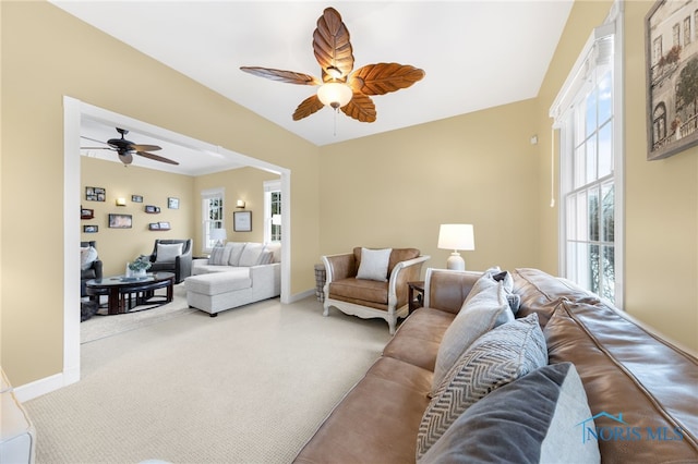 living room featuring carpet flooring and ceiling fan