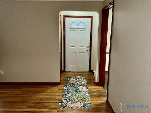 entryway with hardwood / wood-style flooring