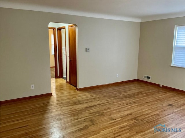 empty room with hardwood / wood-style floors