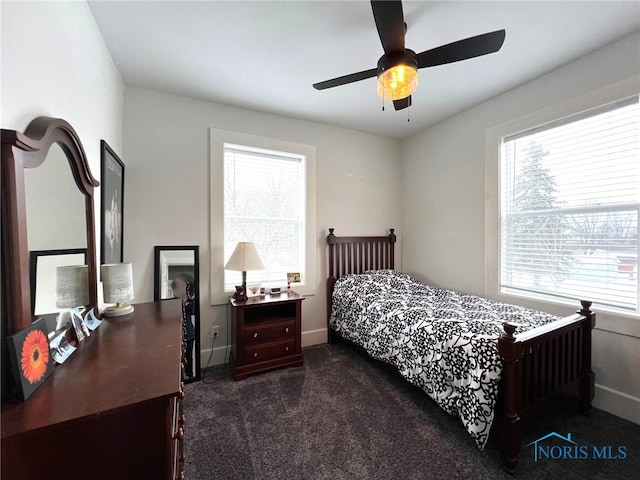 carpeted bedroom featuring ceiling fan