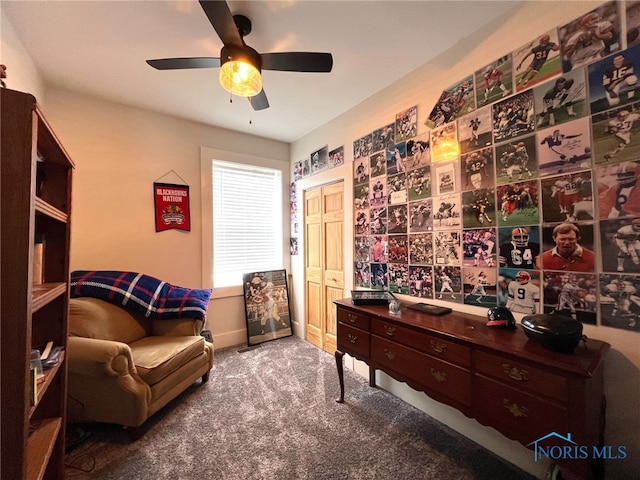 sitting room with ceiling fan and carpet floors