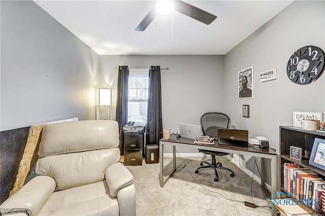 carpeted office featuring ceiling fan